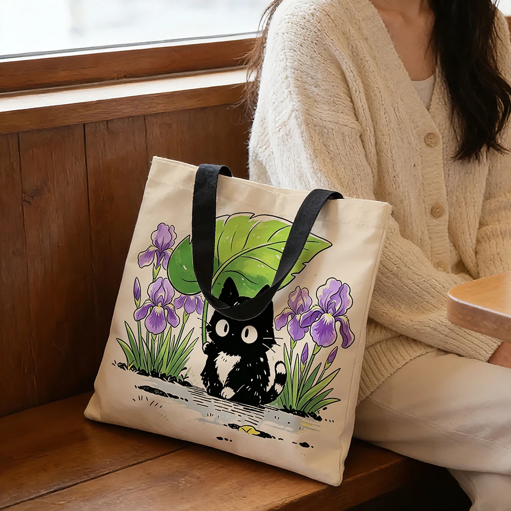 Cute Black Kitten Iris Flower Canvas Tote Bag &ndash; Adorable Cat Holding Leaf Umbrella Floral Print, Eco-Friendly Soft Shoulder Bag