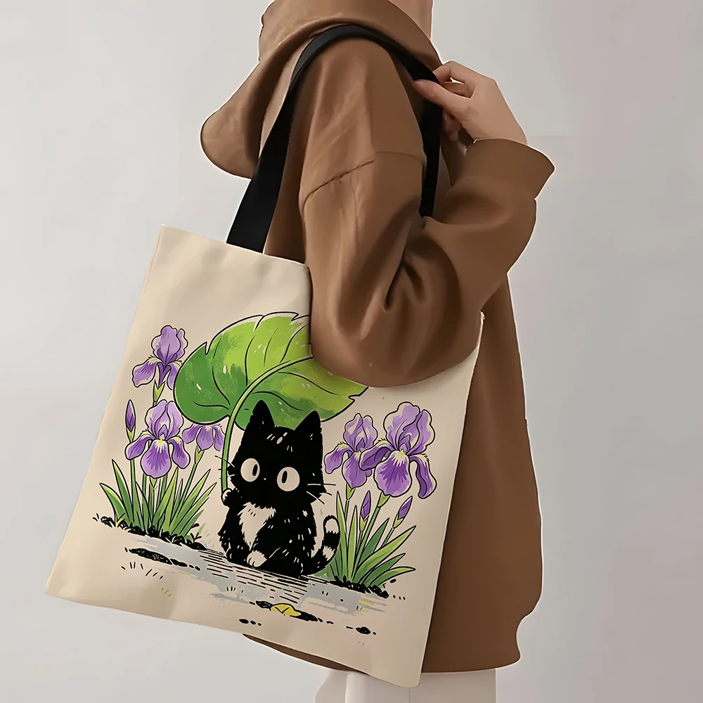 Cute Black Kitten Iris Flower Canvas Tote Bag &ndash; Adorable Cat Holding Leaf Umbrella Floral Print, Eco-Friendly Soft Shoulder Bag