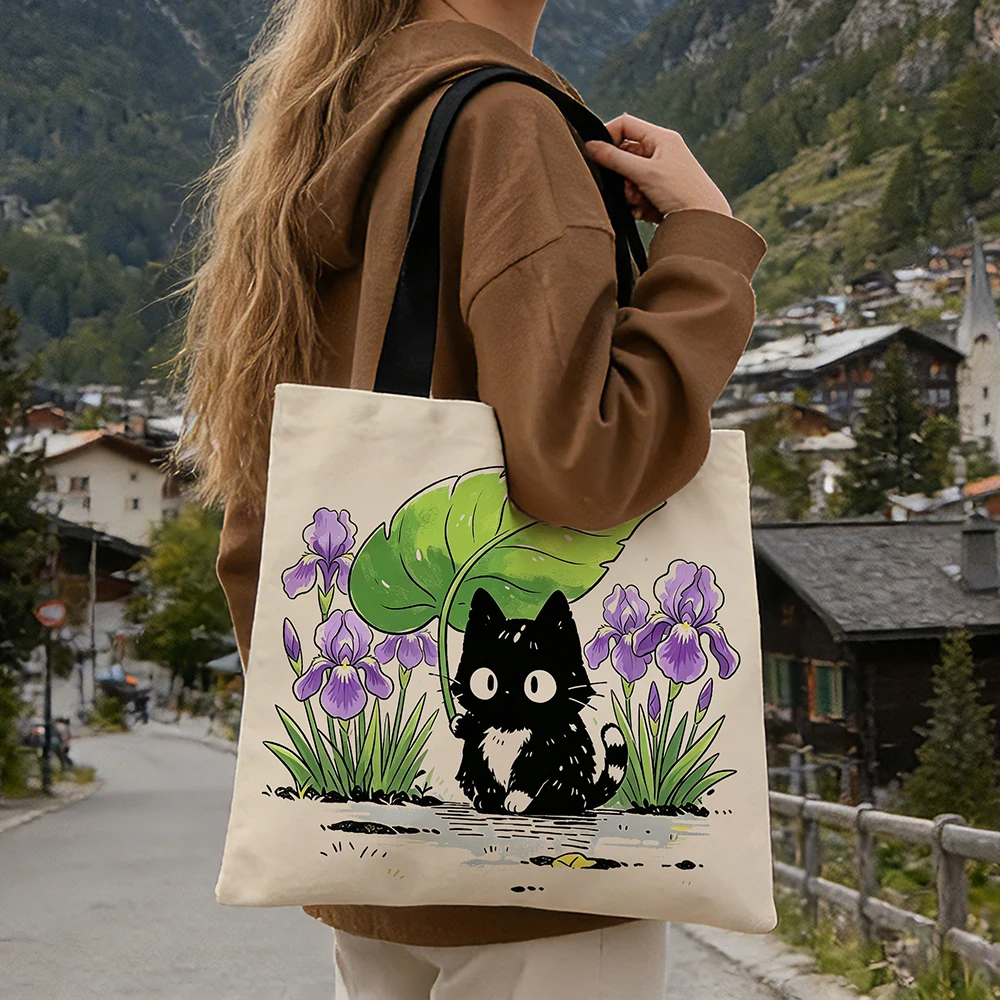 Cute Black Kitten Iris Flower Canvas Tote Bag &ndash; Adorable Cat Holding Leaf Umbrella Floral Print, Eco-Friendly Soft Shoulder Bag